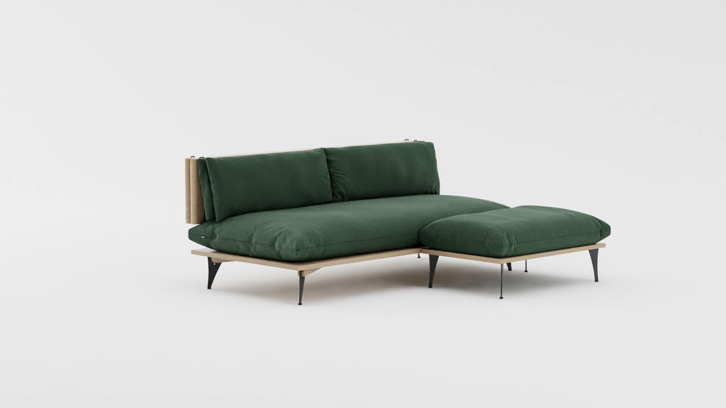 Five in one transformable sectional sofa with ottoman in forest royal green color. VIew at an angle.